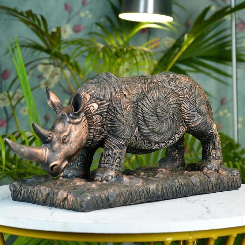 MAYII rhino home decor statue tabletop sculpture with intricate carved patterns on a decorative base