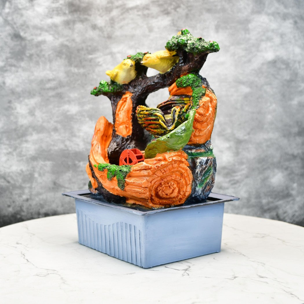 Colorful elegant indoor fountain decor featuring birds and tree design on blue base