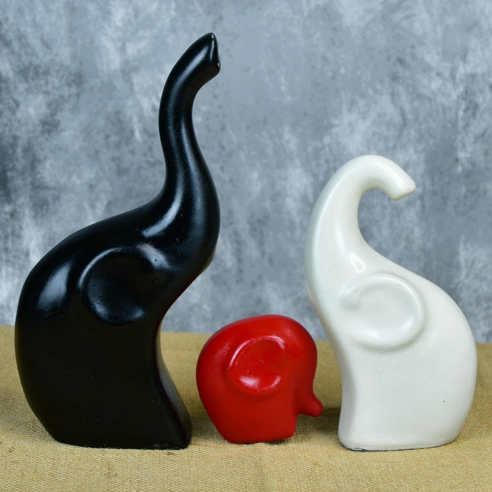 MAYII tabletop elephant home decor accents set featuring black, red, and white stylized elephant figurines