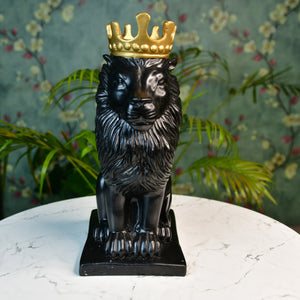 MAYII luxury lion showpiece decor in black with a gold crown sitting on a white marble tabletop