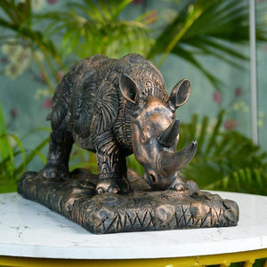 MAYII tabletop rhino home decor statue with intricate carved details on decorative base