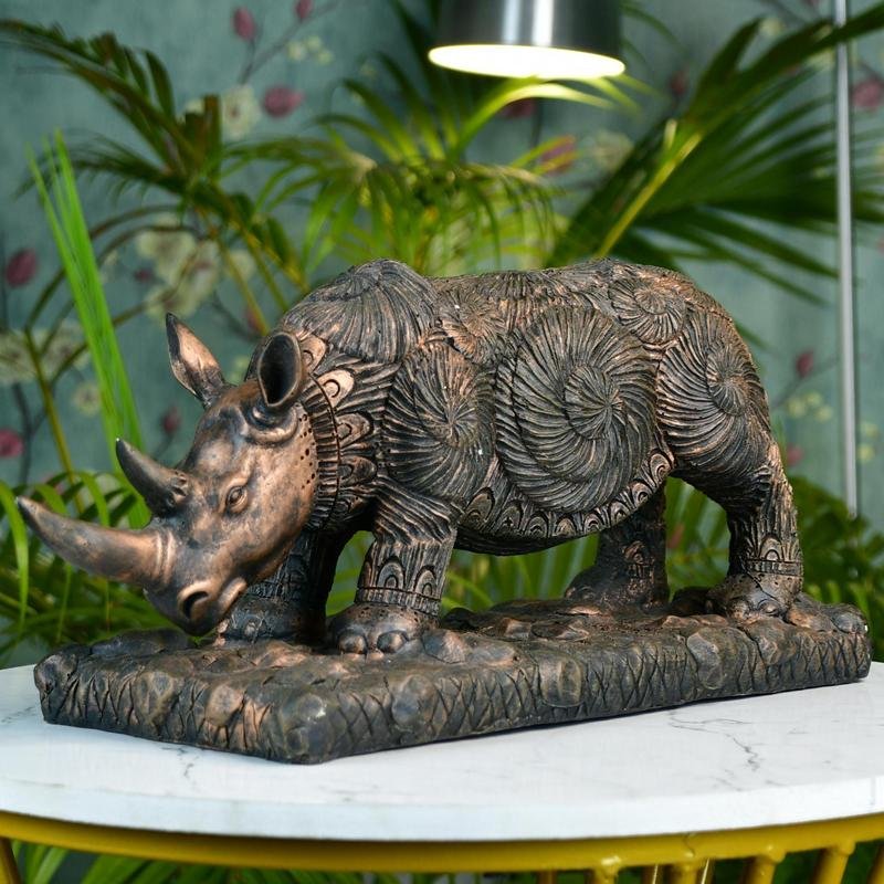 MAYII tabletop rhino home decor statue with intricate patterns on a decorative base